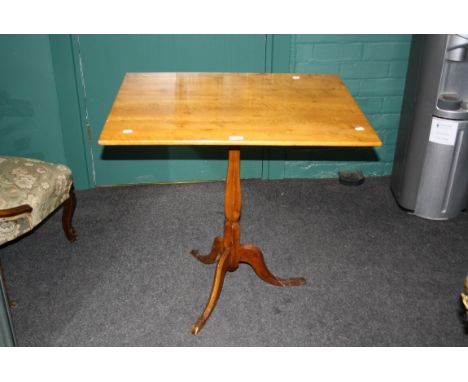 An early 19th century Swedish figured birch rectangular topped tripod table, with simple cabriole supports, 78.5cm