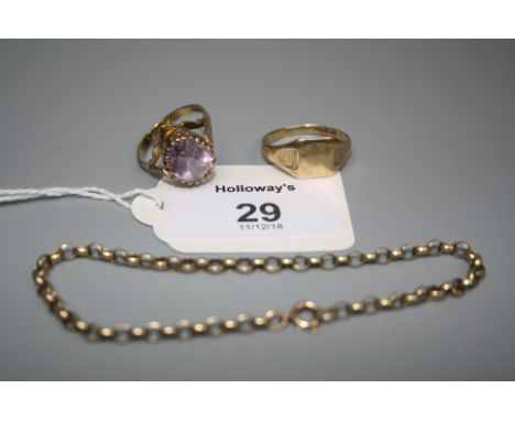 A single stone amethyst dress ring, the oval cut amethyst in claw mount and pierced setting, together with a 9ct gold signet 