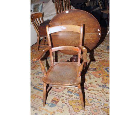 A late George III oak circular snap top tripod table, together with a 19th century  Oxford type bar back elbow table with sol