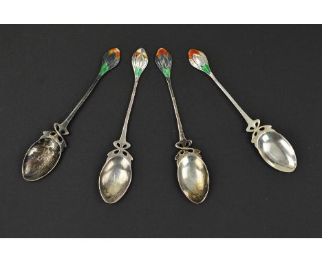 A SET OF FOUR WILLIAM HAIR HASELER SILVER AND ENAMEL TEASPOONS, the handle finials enamelled in green and orangey red surroun