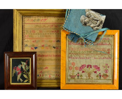 A LATE 19TH CENTURY NEEDLEWORK SAMPLER, woolwork on an open linen ground, with alphabets, numerals , religious verse, flowers