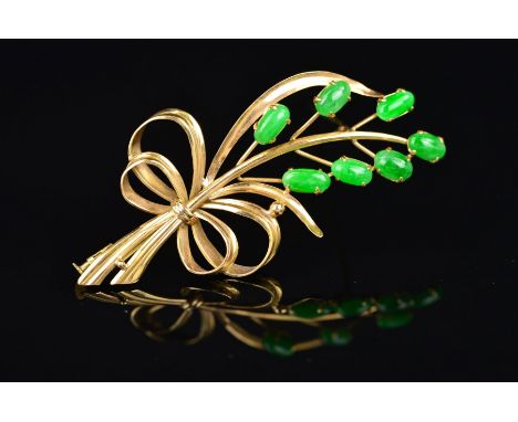 A MID TO LATE 20TH CENTURY JADE FOLIATE SPRAY BROOCH, measuring approximately 64mm in length x 38mm in width, seven oval cabo