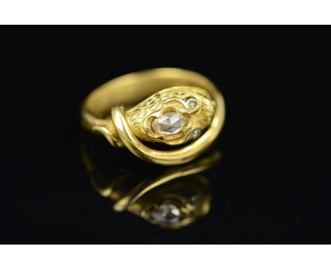 A  GOLD DIAMOND SNAKE RING, the ring designed as a snake, the head with engraved scale detail and set with an oval rose cut d