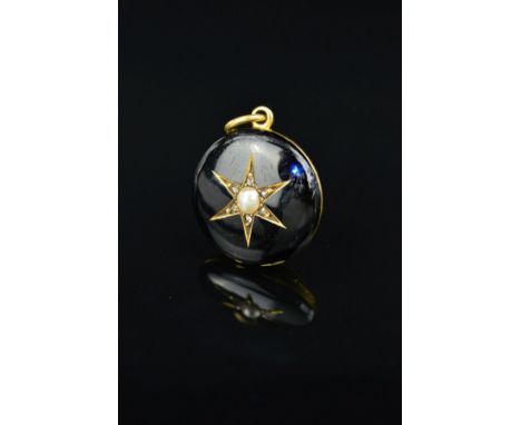 A MID VICTORIAN GOLD ENAMEL, DIAMOND AND PEARL MEMORIAL PENDANT, of circular outline, the star setting with central split pea