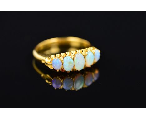 AN EARLY 20TH CENTURY FIVE STONE OPAL GRADUATED HALF HOOP RING, ring size P 1/2, approximate gross weight 5.7 grams