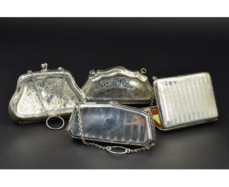 THREE EARLY 20TH CENTURY SILVER LADIES PURSES, of shaped design, on chain suspensions and with finger rings, two foliate engr