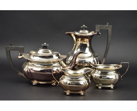 AN ELIZABETH II SILVER FOUR PIECE TEASET, of lobed oval form, on four bun feet, comprising teapot, hot water jug, twin handle