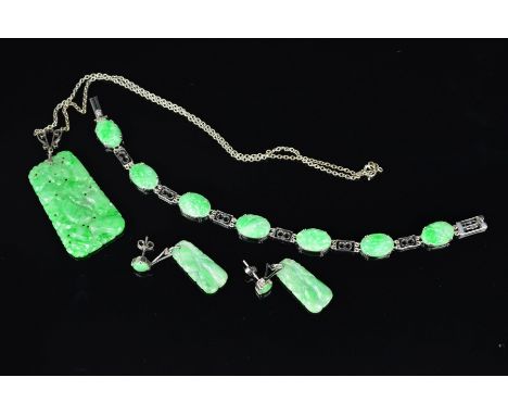A VINTAGE SUITE OF JADE, a Chinese carved jade seven oval panel piece bracelet, each oval panel relief carved with foliate, f