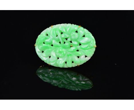 A MID 20TH CENTURY 9CT JADE BROOCH, an oval floral and foliate carved design, measuring approximately 38mm x 26mm, hallmarked