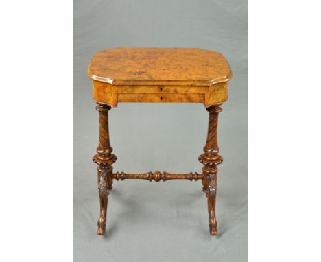 A VICTORIAN BURR WALNUT LADIES WRITING/WORK TABLE, the shaped rectangular hinged top enclosing a tooled green leather inset w