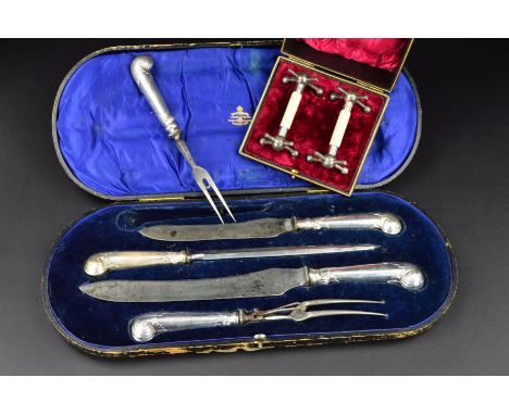 AN EDWARDIAN SILVER PISTOL HANDLED FIVE PIECE GAME AND MEAT CARVING SET, Carrington &amp; Co of Regent Street case, blades, p