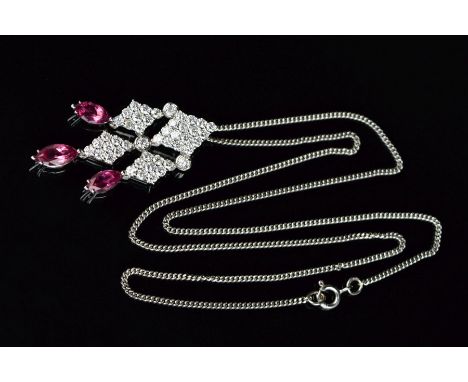 A PICCHIOTTI 18CT WHITE GOLD MODERN FANCY DIAMOND AND PINK TOURMALINE PENDANT, centring on a diamond cross shape centre compr