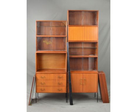 PETER HAYWARD FOR VANSON, a Teak 1950's mahogany modular shelving units, comprising of two double cupboard bases, fall front 