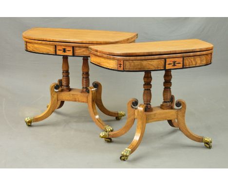 A NEAR PAIR OF REGENCY WALNUT, BRASS AND EBONY INLAID FOLD OVER 'D' SHAPE CARD TABLES, green baize lined interiors, supported