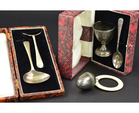 A CASED ELIZABETH II SILVER EGG CUP AND SPOON, engraved initials, makers Walker &amp; Hall, Sheffield 1953, together with a c