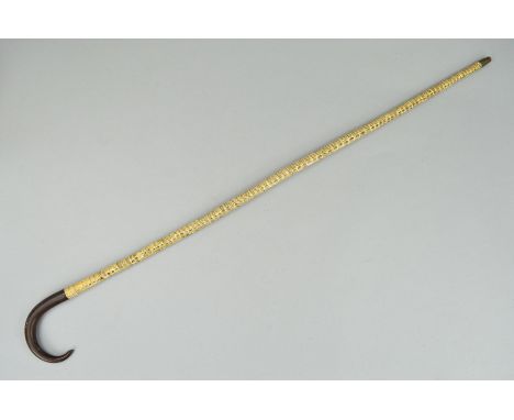 A 19TH CENTURY GRADUATED SHARK VERTEBRAE WALKING STICK, with hooked horn handle, metal ferrule, length 89.5cm