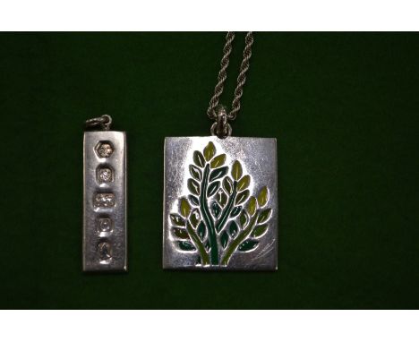A silver and enamel pendant and chain and a silver Hallmark pendant.