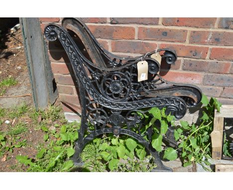 A pair of cast iron bench ends.