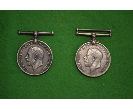 Two WWI medals, one name Private T W Major Army Service Corp, the other Private J Smith Highland Light  Infrantry.