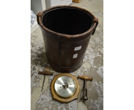 Waste paper bin, barometer and two cork screws.