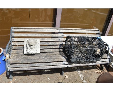 A good cast iron and wooden slatted garden bench.