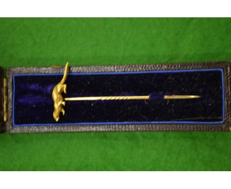 A 9ct gold stick pin.