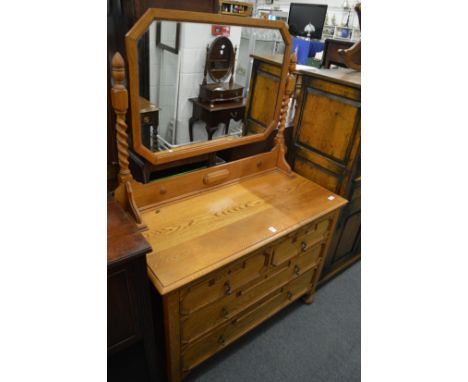 A light oak dressing chest.