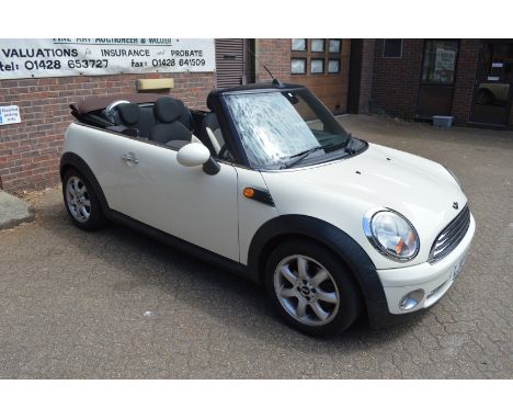 A Mini Cooper two door convertible 1.6 litre petrol engine, 56,000 miles, 12 months MOT, new soft top recently fitted, with s
