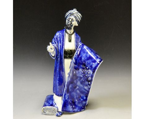 A Royal Doulton figure , The Carpet Seller, flambe blue, HN2776