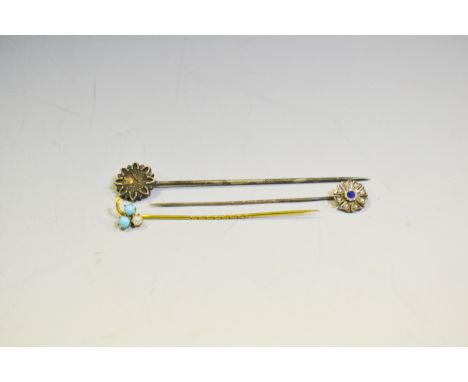 A Victorian gold coloured metal seed pearl and turquoise stick pin; another, sapphire and seed pearl; another, Aesthetic Move