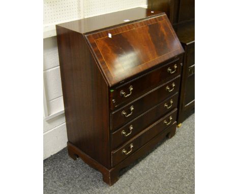 A contemporary mahogany bureau, the satinwood inlaid fall front enclosing tanned tooled leather writing surface and pigeon ho