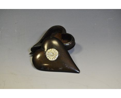 A 19th century treen heart shaped snuff box, push-fitting cover inlaid with an inscribed mother of pearl roundel