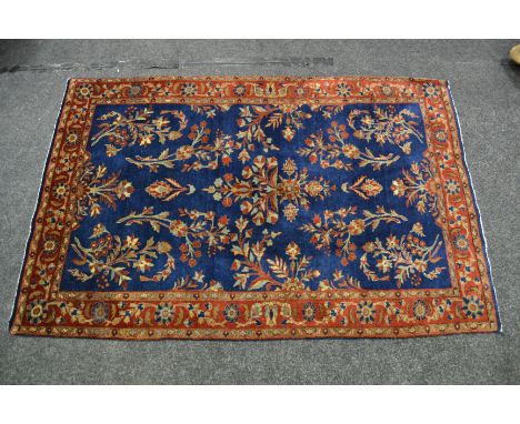 A Sarough carpet, West Persia, cobalt blue madder field, stylised flowerheads, conforming border, 1.55m x 1.0m 