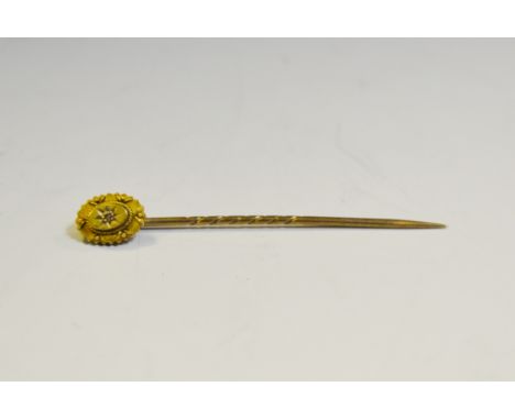 A 15ct gold mounted and diamond set stick pin