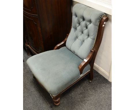  A Victorian mahogany button back nursing chair, stuffed overseat, turned forelegs, ceramic casters, circa 1860.