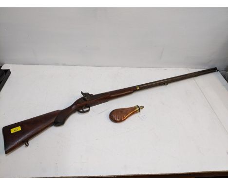 A 19th century percussion firing rifle, muzzle loading with percussion cap firing action, carved stock, stamped marks 33*/X1X