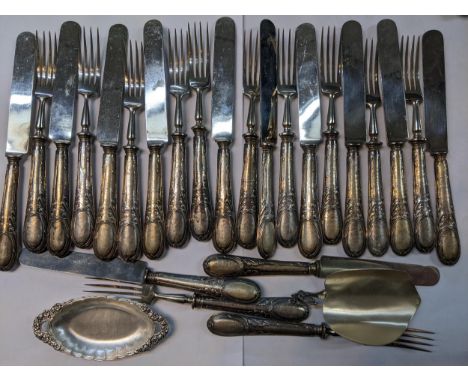 A set of Continental silver handles, dessert knives and forks for twelve, with a scoop and a dish Location: 