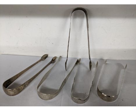 Four early 19th century silver sugar tongs together with a pair of Georgian silver tongs, by George Smith, total weight 163.6