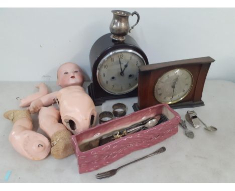 A mixed lot to include two mid 20th century mantel clocks, a pair of white metal napkin rings, mixed cutlery, an Acme Thunder