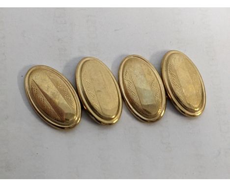 A pair of 9ct gold oval engine turned cufflinks 2.75g Location: 
