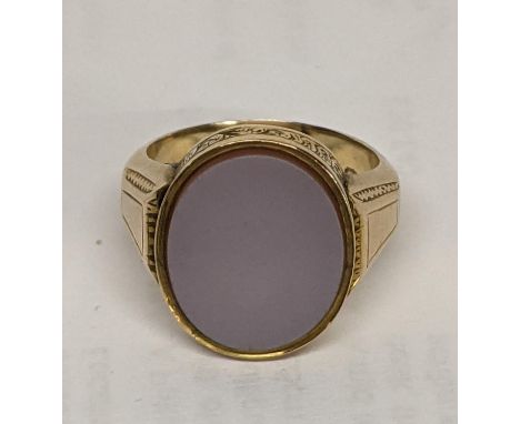 A 9ct gold signet ring set with an oval stone, 6.4gLocation: 