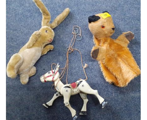 A vintage Sooty hand puppet, a vintage hare fur toy with wired arms and ears, with glass eyes and a Muffin the Mule puppet 