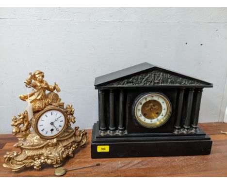 A Victorian black slate cased mantel clock of temple style with classical frieze to the top, open pillars below, the gilt dia