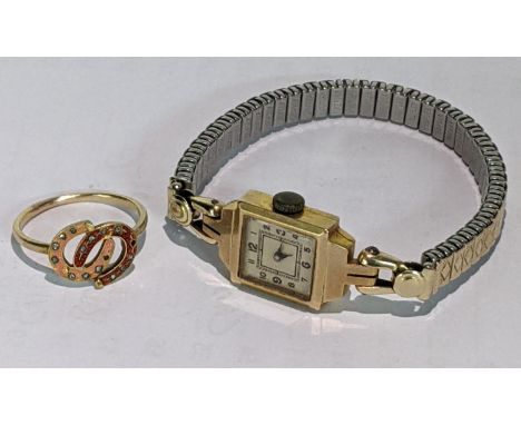 A 9ct gold ladies watch on a later expanding bracelet together with a yellow metal ring, 3.1g, total weight 6.3gLocation: 