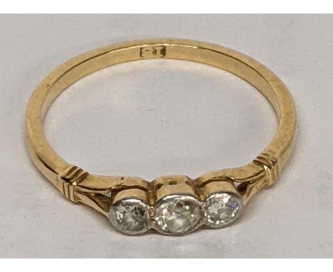 A 9ct gold ladies ring inset with three diamonds, total weight 2.0g Location: 