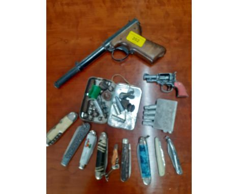 An air pistol A/F, together with bullets, accessories and other items to include penknives, Location: R 2:3 