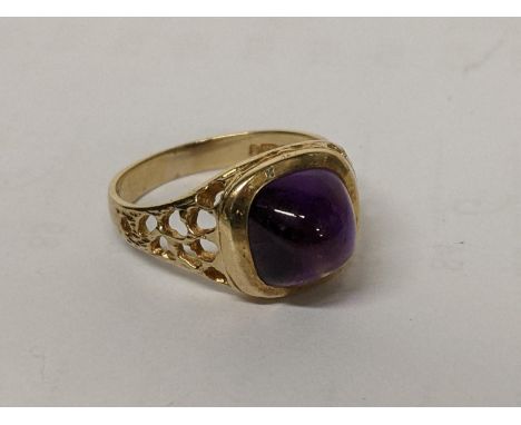 A 9ct gold ring with pierced shoulders and inset with a large amethyst, 4.6gLocation: 