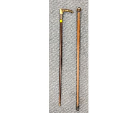 Two walking sticks to include a 1920's horn handled stick with silver band, hallmarked London 1924Location: 