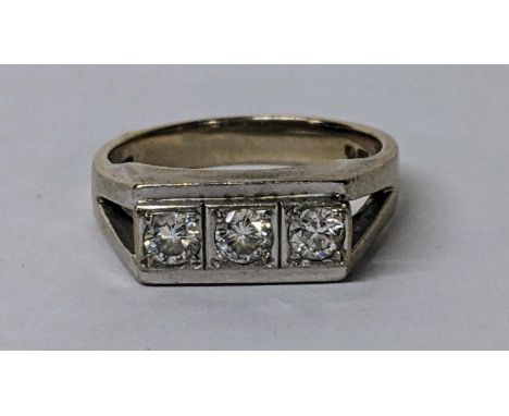 An 18ct white gold diamond three-stone ring 7.8g Location: 