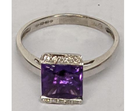 A 18ct white gold ladies ring inset with diamonds square cut amethyst, total weight 4.2gLocation: 